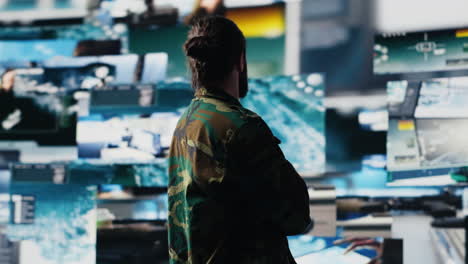 young soldier working in command center with satellite surveillance