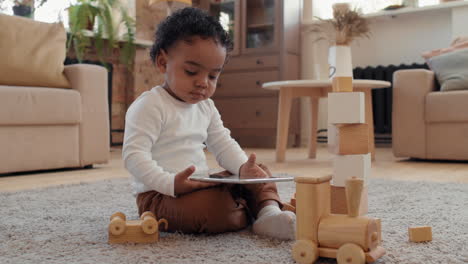 black toddler boy using tablet