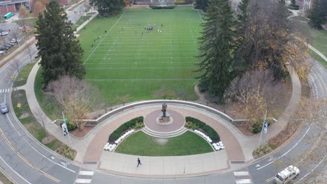 the spartan statue at michigan state university with drone video moving down