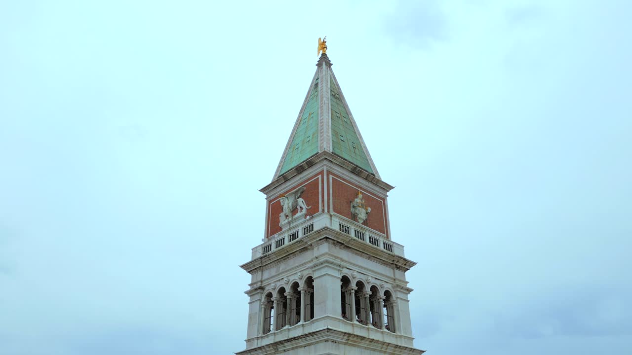 4K Aerial of San Marco, the Rialto Bridge, and the canals in Venice, Italy on a cloudy day-17