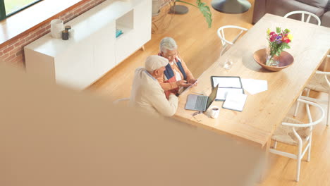 senior couple discussing finances at home