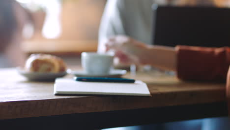 Hand,-coffee-and-phone-with-a-business-woman