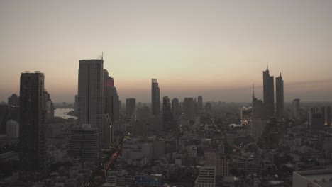 bangkok business district bang rak at the evening - modern architecture at downtown bangkok - skyline bangkok at sunset - 4k cinematic high resolution shot - outdoor shot wallpaper