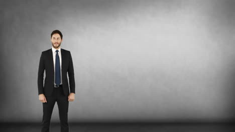 man in suit standing proudly.