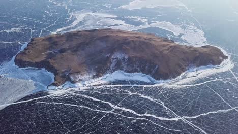 aerial high view of icy cracks at lake baikal in russia