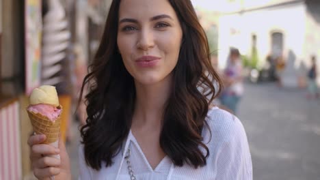 beautiful brunette woman eating delicious and sweet ice cream