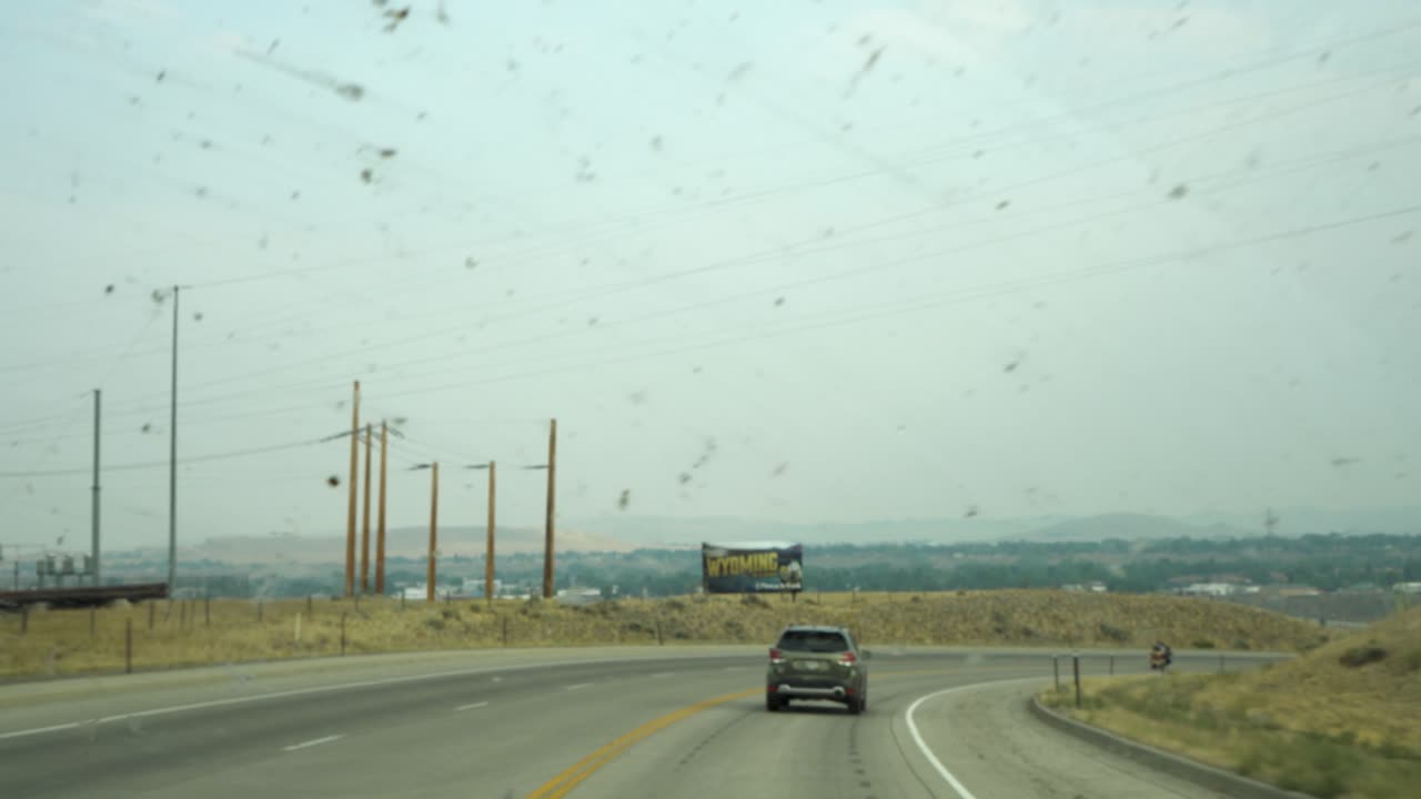 A rural electric plant as seen from the window of an RV.