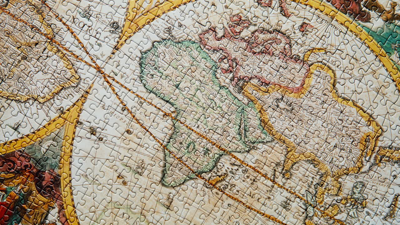 Top view assembled map puzzle. Jigsaw antique geographical landscape closeup