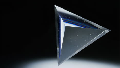 abstract prism with light refraction on dark background