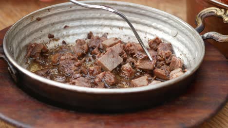 roasted or fried beef in a pan