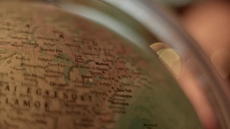 abstract blurry close-ups of a person and a globe with bokeh lights