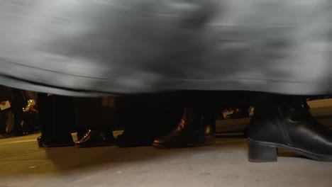 procession in black robes at night