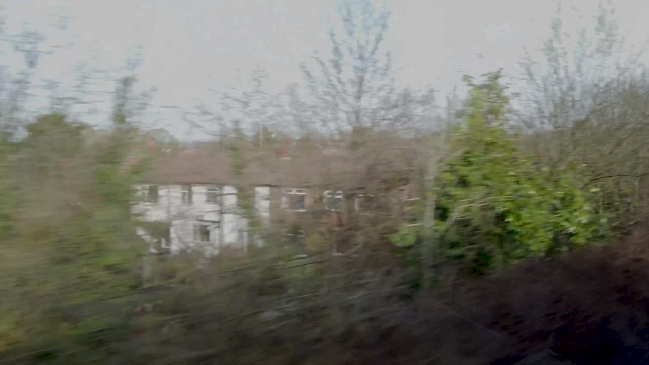 View from a window of train window traveling towards Manchester, UK