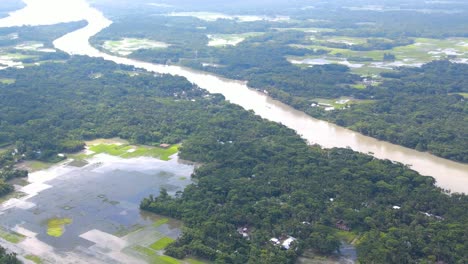 aerial landscape of overflown flooded river with agriculture land