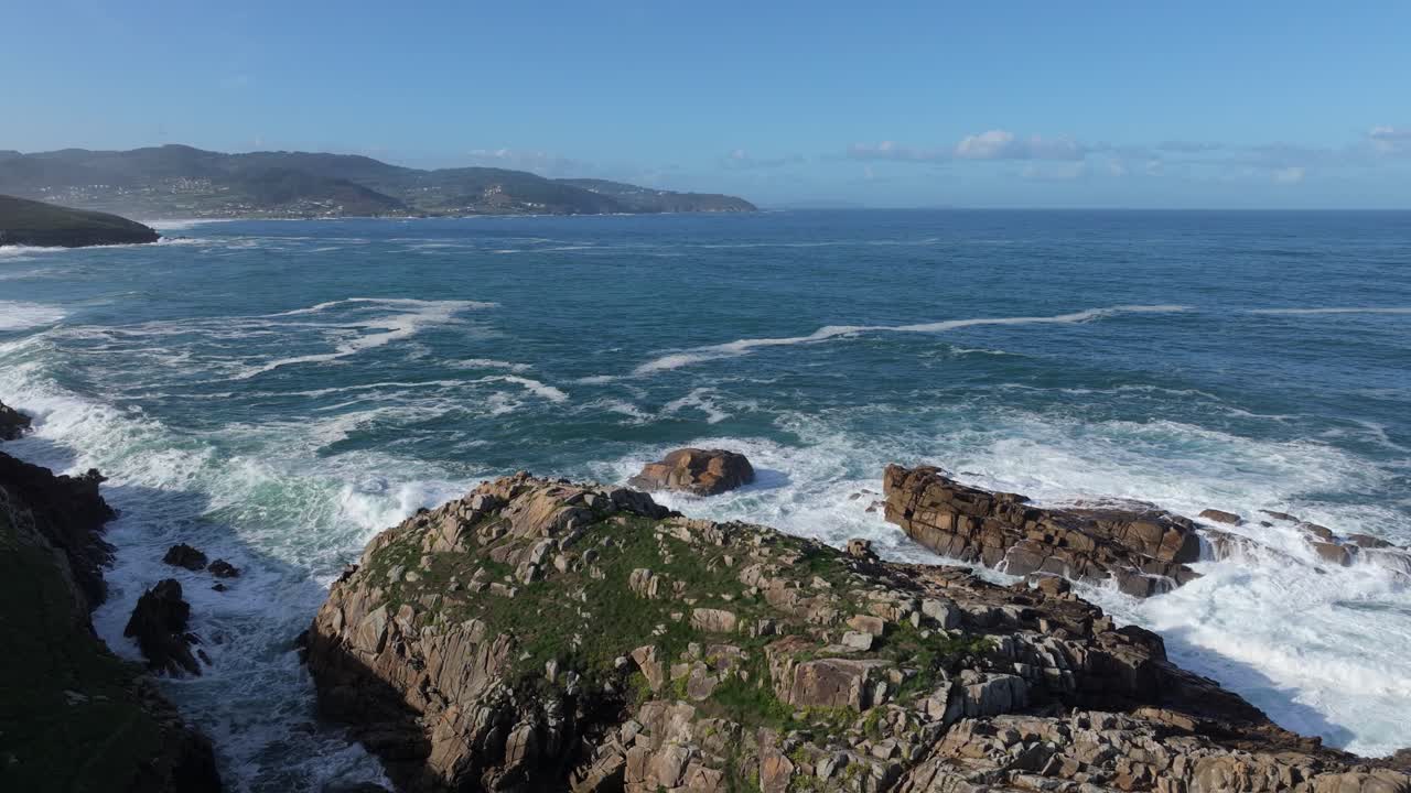 Rock And Waves Near Senda Azul (Paseo Marítimo de Arteixo) Coastal Hike In Arteixo, A Coruña, Galicia, Spain. Aerial Pullback Shot
