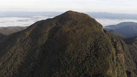 aerial view circling the summit of a rainforest tropical mountain, pico caratuva, brazil, south america