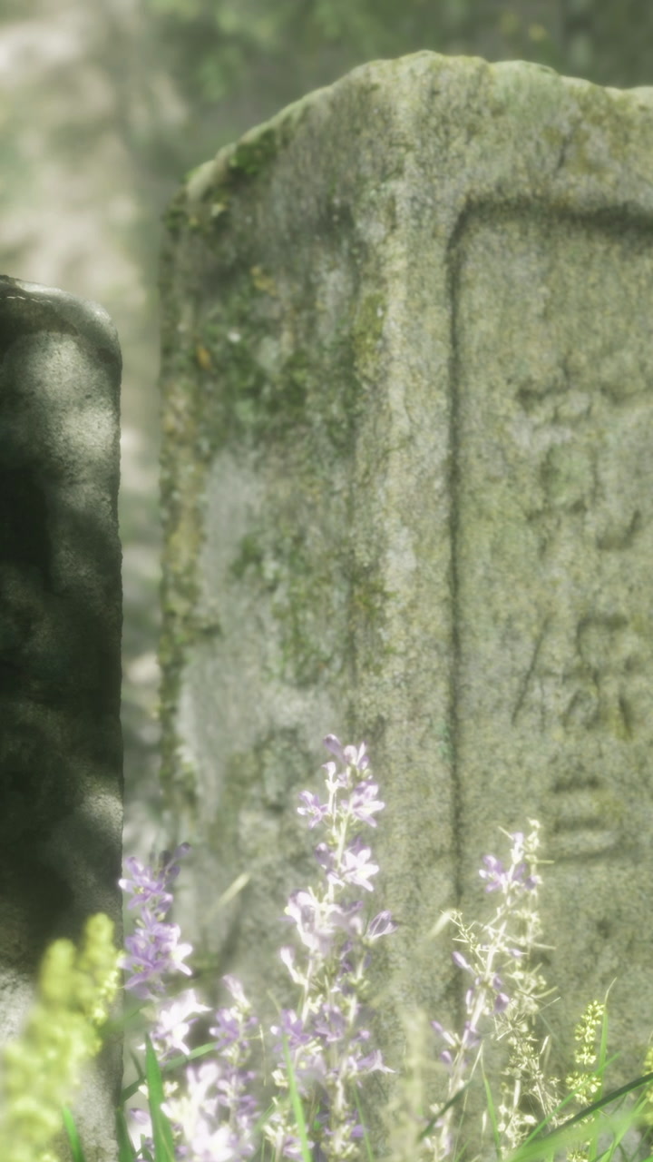 Old grave markers with flowers in a quiet cemetery during daylight