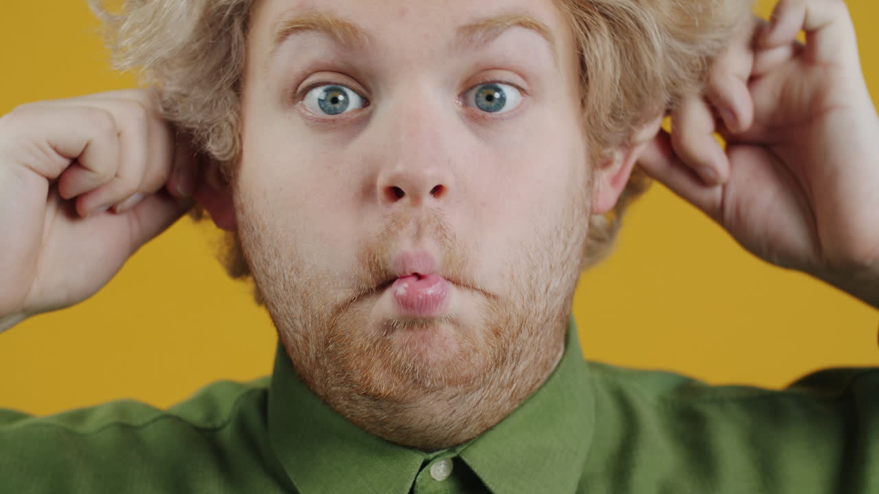 Funny Man Pulling His Ears