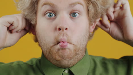 Funny Man Pulling His Ears