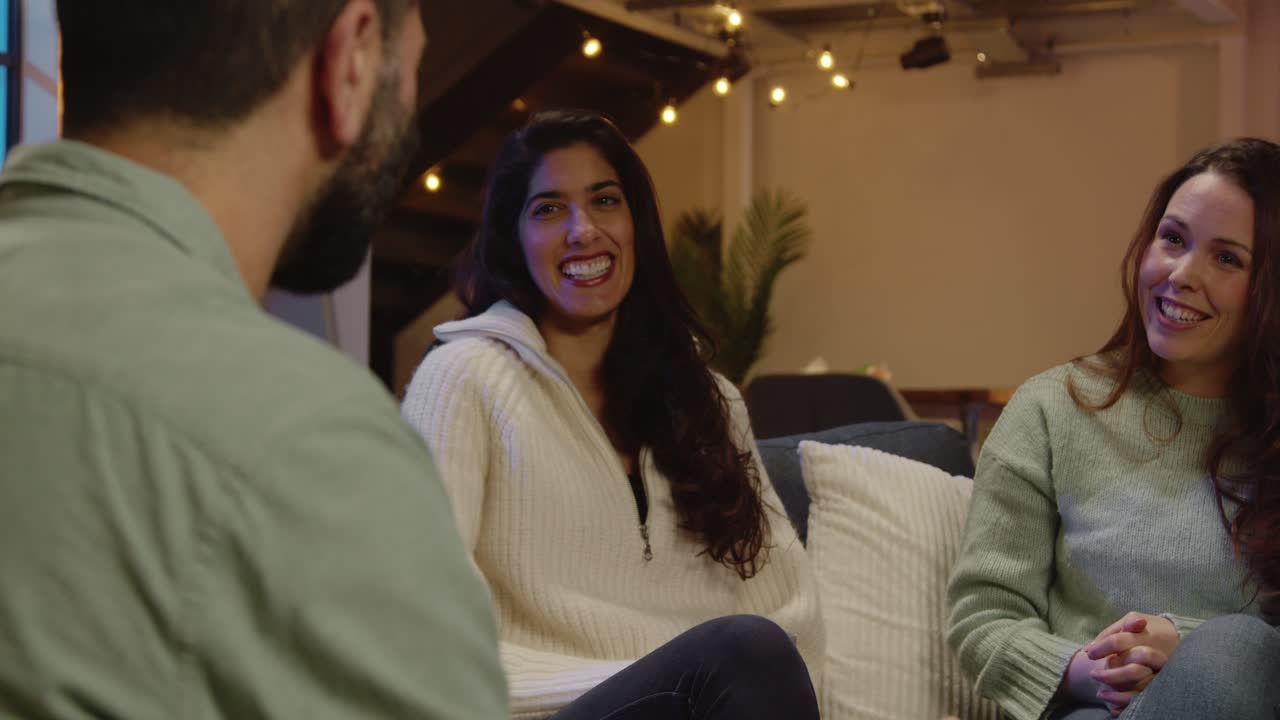 Relaxed Group Of Friends Sitting On Sofa At Home Or In Bar Or Coffee Shop Talking And Drinking Coffee Together 7