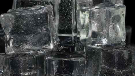 pouring soda, alcohol vodka, tequila, gin, water into drinking glass with ice cubes, slow motion