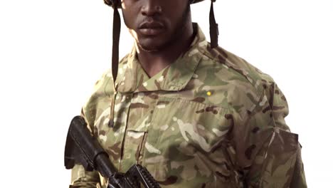 portrait of military soldier holding machine gun