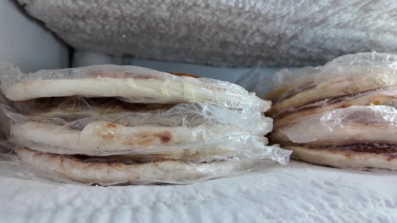 Frozen Pizzas in Freezer