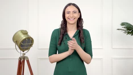 Happy-Indian-girl-clapping-and-cheering