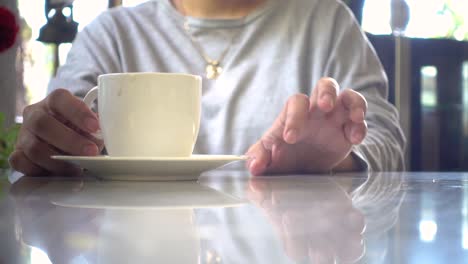 a frustrated young impatient girl is bored waiting in the cafe