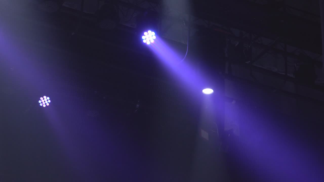Stage lights shining at studio. Seamless looping animation.