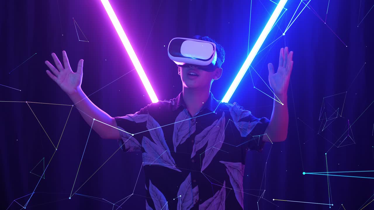 Vr, Futuristic, Entertainment Concept. Excited Asian Boy Using Virtual Reality Headset With Neon Light At The Background