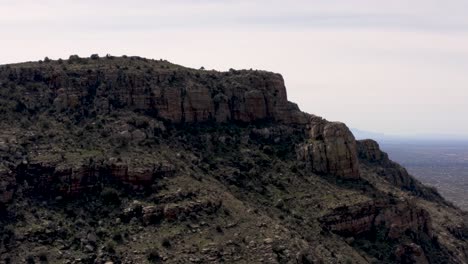 Reveal-of-Tucson-City-from-behind-a-ridge