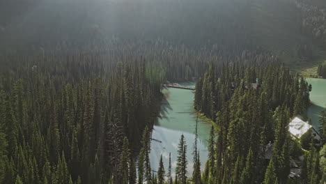 Emerald-Lake-BC-Canada-Aerial-v9-drone-flyover-lakeside-lodge-capturing-stunning-vistas-of-forested-valley,-mountains,-and-calm-waters-of-Yoho-National-Park---Shot-with-Mavic-3-Pro-Cine---July-2023