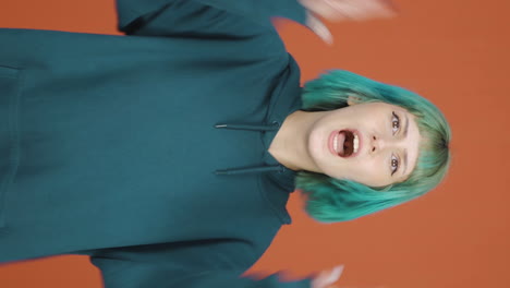 Vertical-video-of-Young-woman-getting-angry-at-camera.