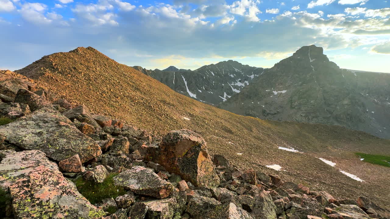 Mount of the Holy Cross 14er Rocky Mountain Sawatch Range Peak Colorado Alpine backcountry landscape view from Notch Mountain Shelter Halo Ridge spring summer Golden hour sunset pan right motion