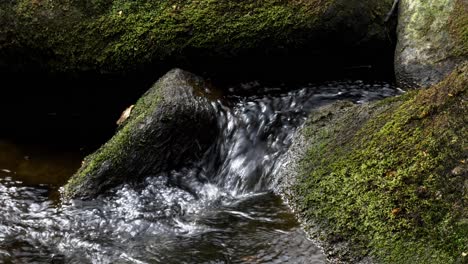 parallax slider view of water flowing over rocks in padley gorge in peak district national park