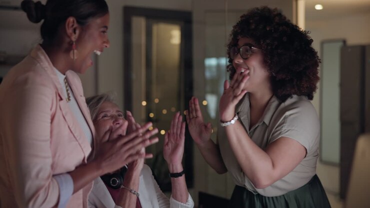 Teamwork, night success and high five of women