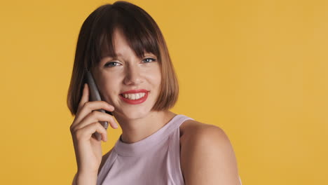 brunette model posing with smartphone