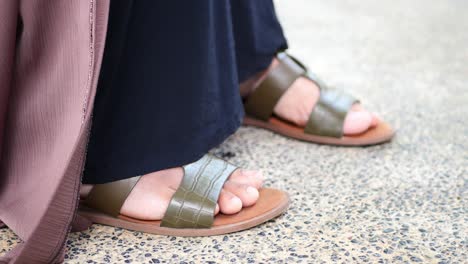 close up of girls feet wearing sandal indoor