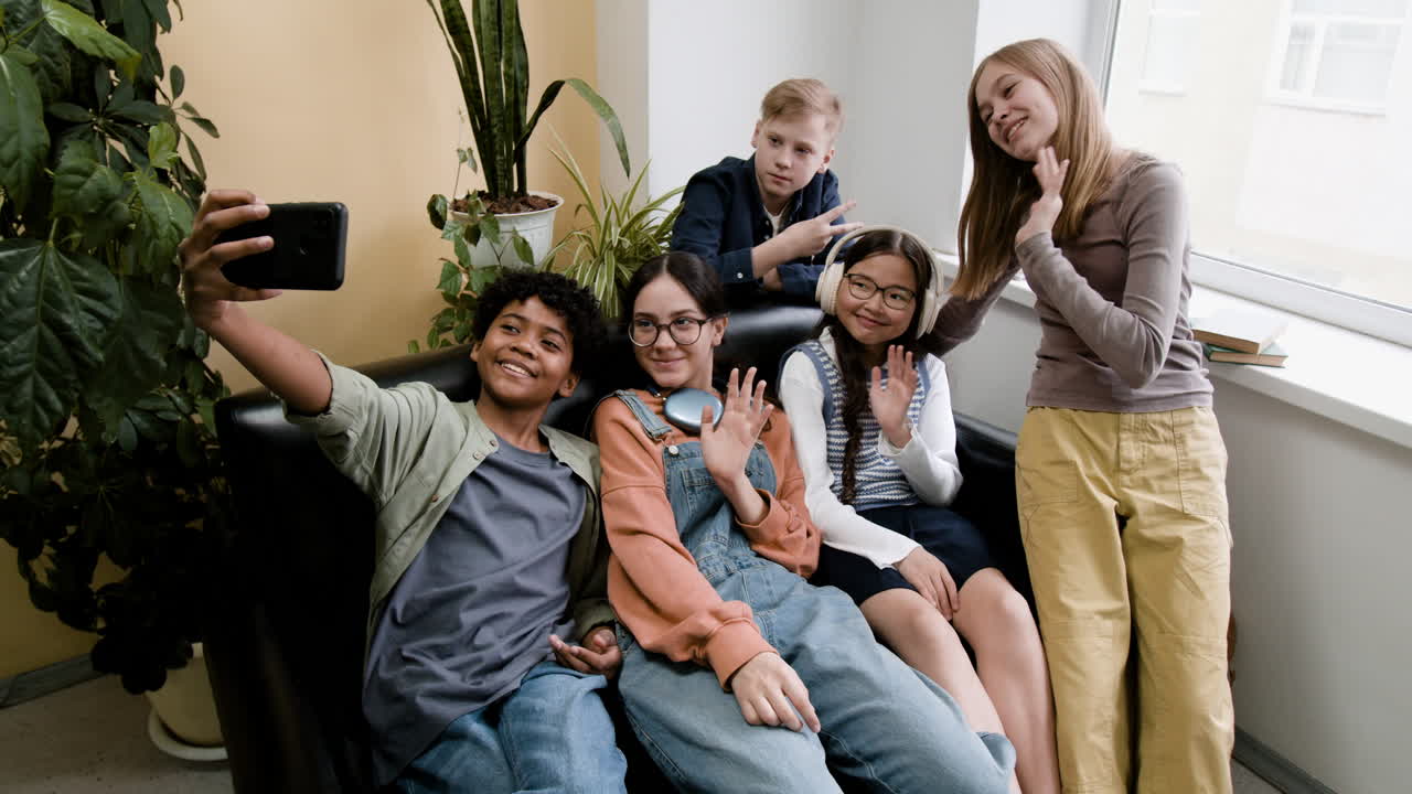 Diverse group of happy teenagers taking a selfie together