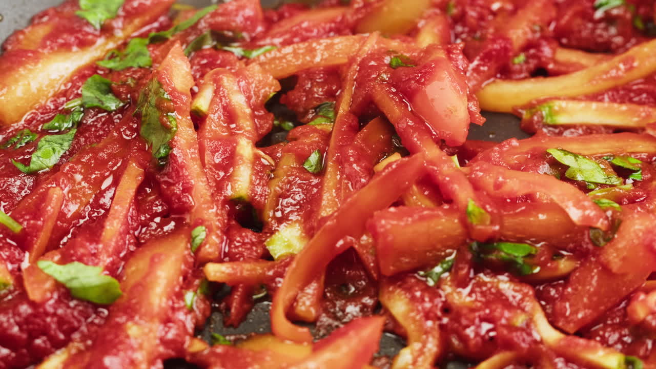 Close-up of Vegetables Simmering in Red Tomato Sauce