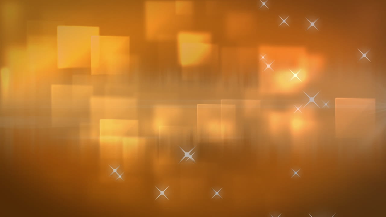 Digitally generated video of orange glowing stars and squares moving against orange background