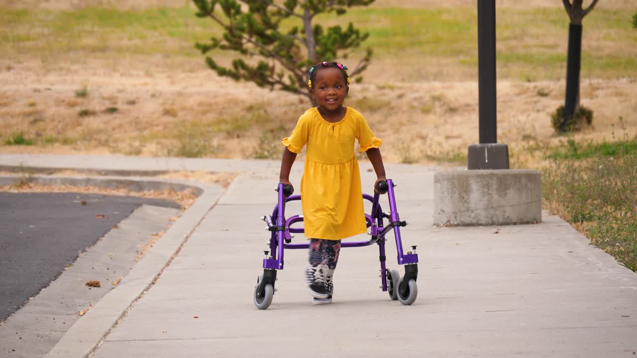 Girl with Cerebral palsy using her walker for mobility