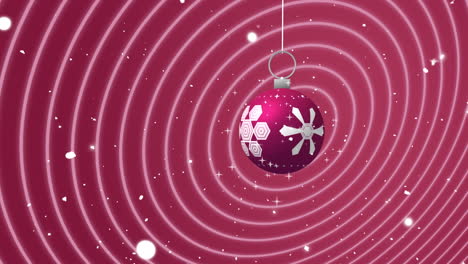 swinging pink and white christmas bauble over falling snow and moving concentric pink rings