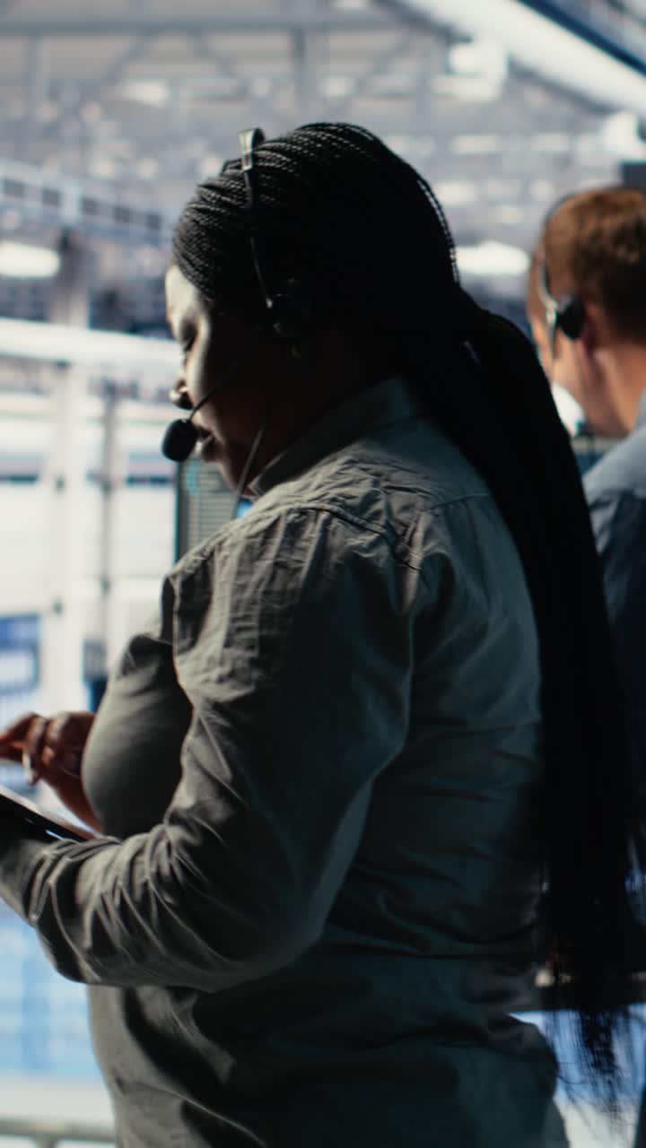 Vertical Video Server Room Tech Support Specialist Guides Clients Set Up Data Backups