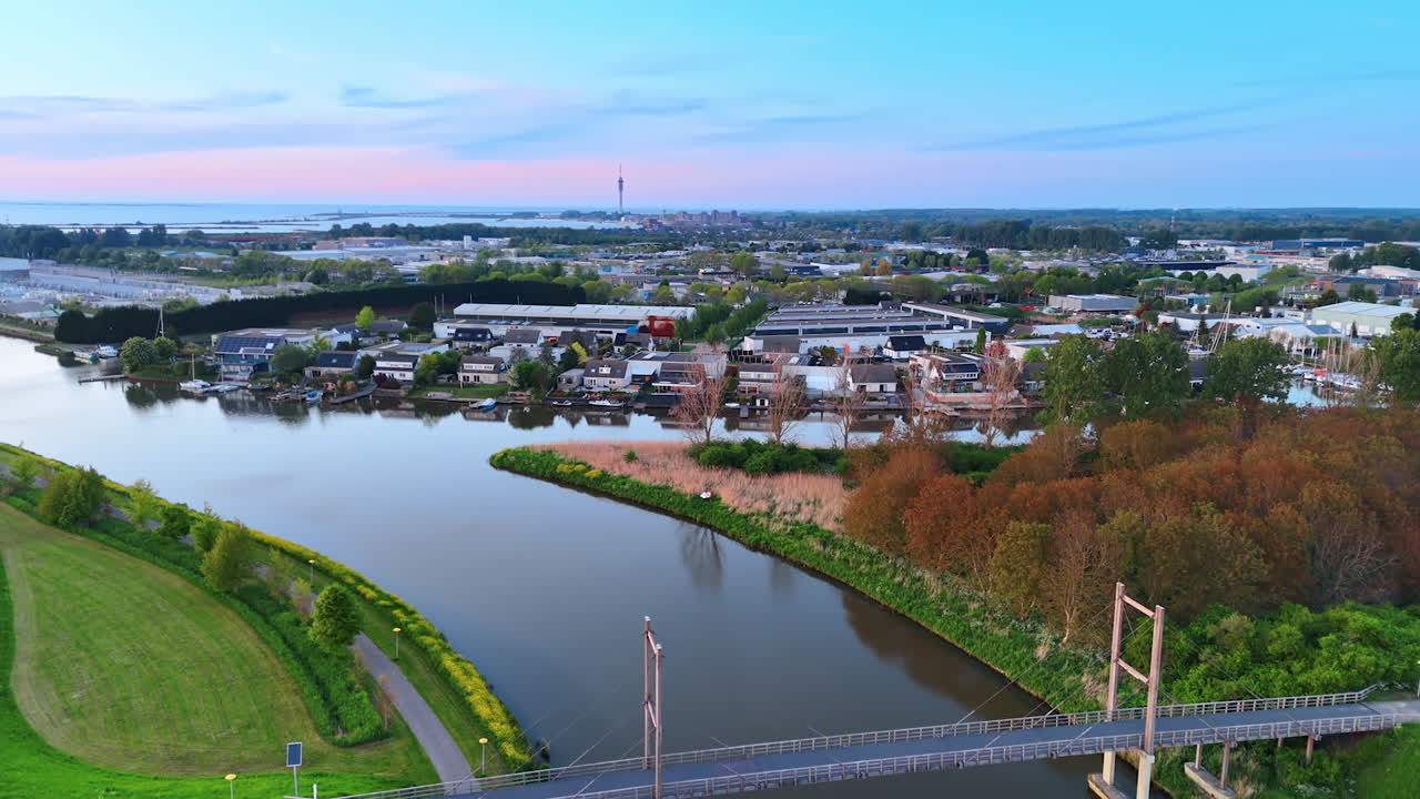 Netherlands bridge view. A tranquil scene showcasing a bridge over a river in the Netherlands during late afternoon