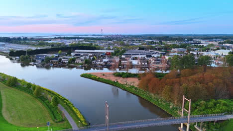 netherlands bridge view. a tranquil scene showcasing a bridge over a river in the netherlands during late afternoon