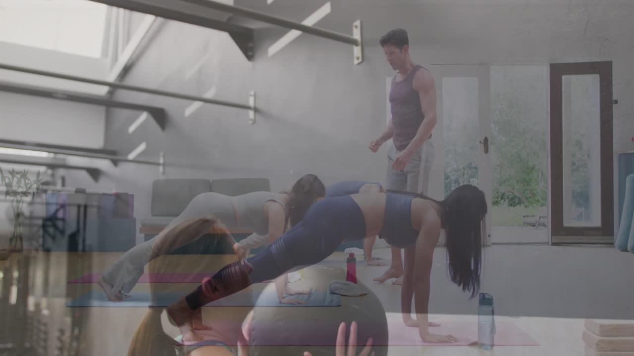 Practicing yoga with instructor guiding poses, people following animation on screen