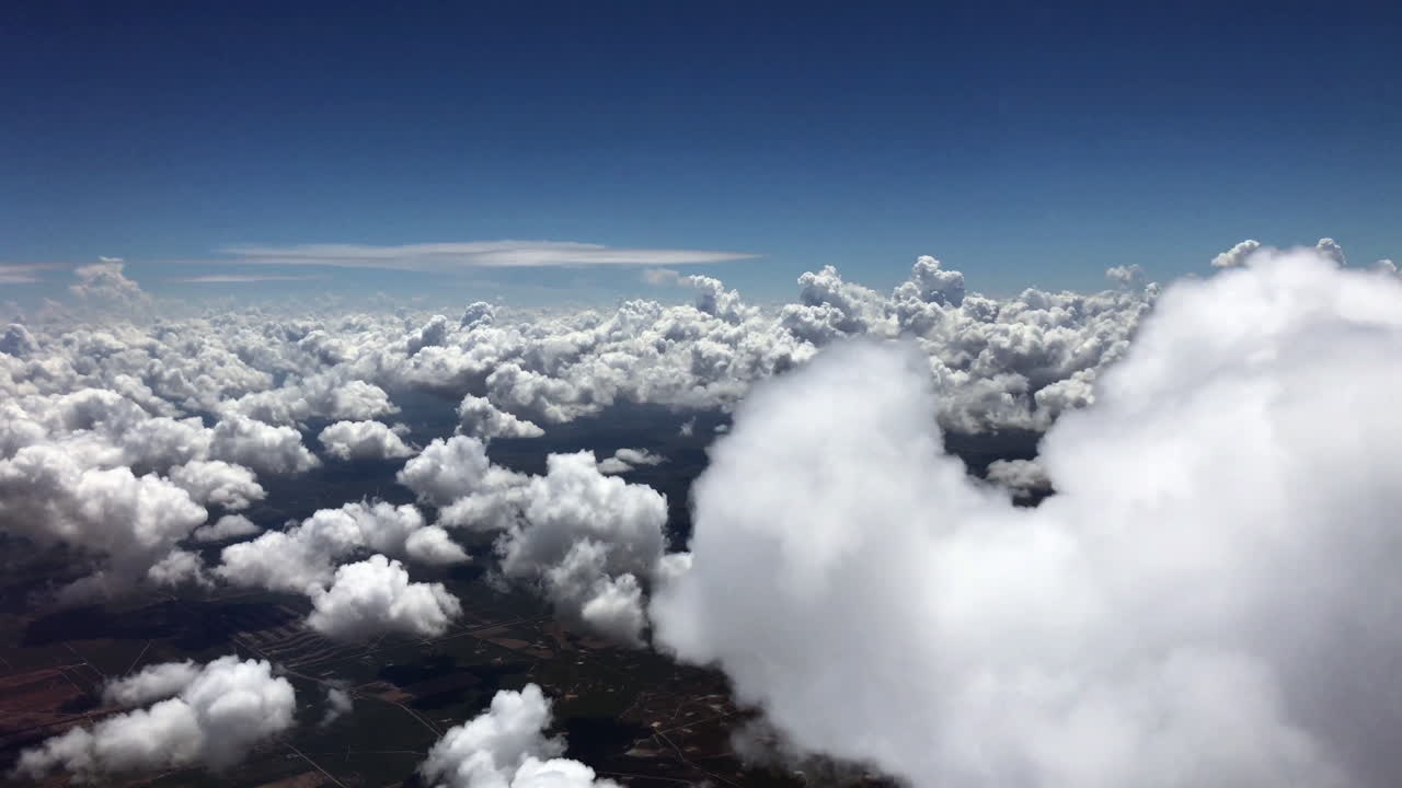 Beautiful Aerial View of Fluffy White Clouds and Blue Sky