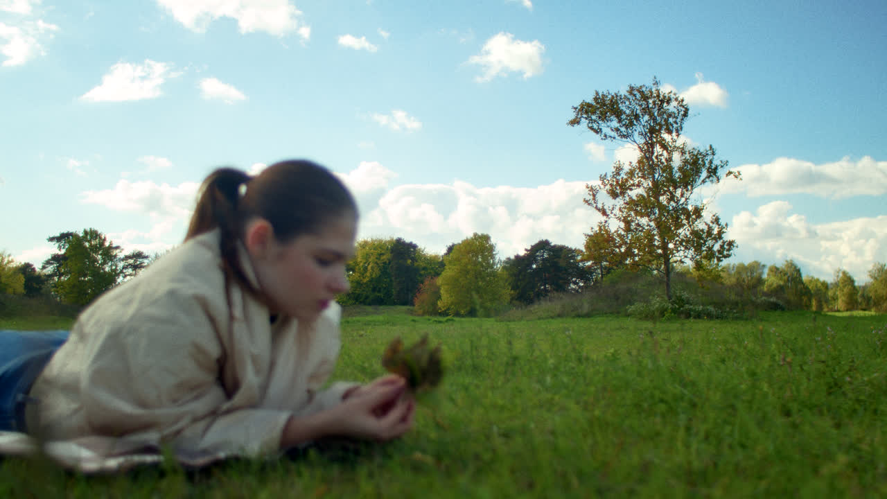 Woman relaxing in a park in autumn
